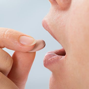 Patient taking oral sedative pill