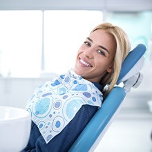 Smiling woman in dentist’s chair